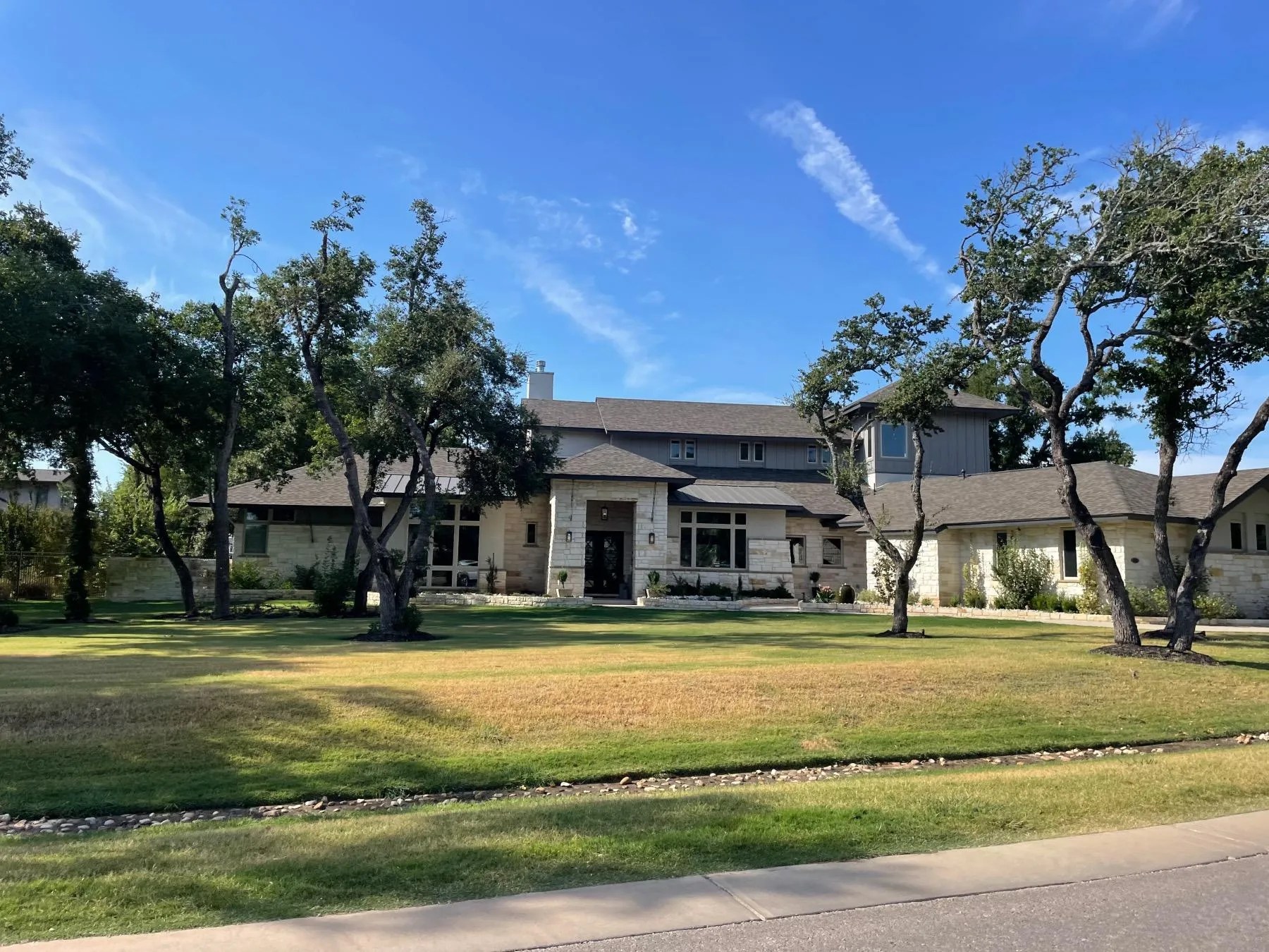 Custom home on wooded acreage lot in Bunker Ranch, Dripping Springs TX