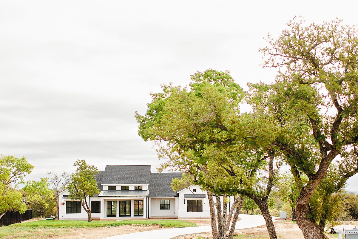 Gated entrance and Hill Country landscape at Bunker Ranch