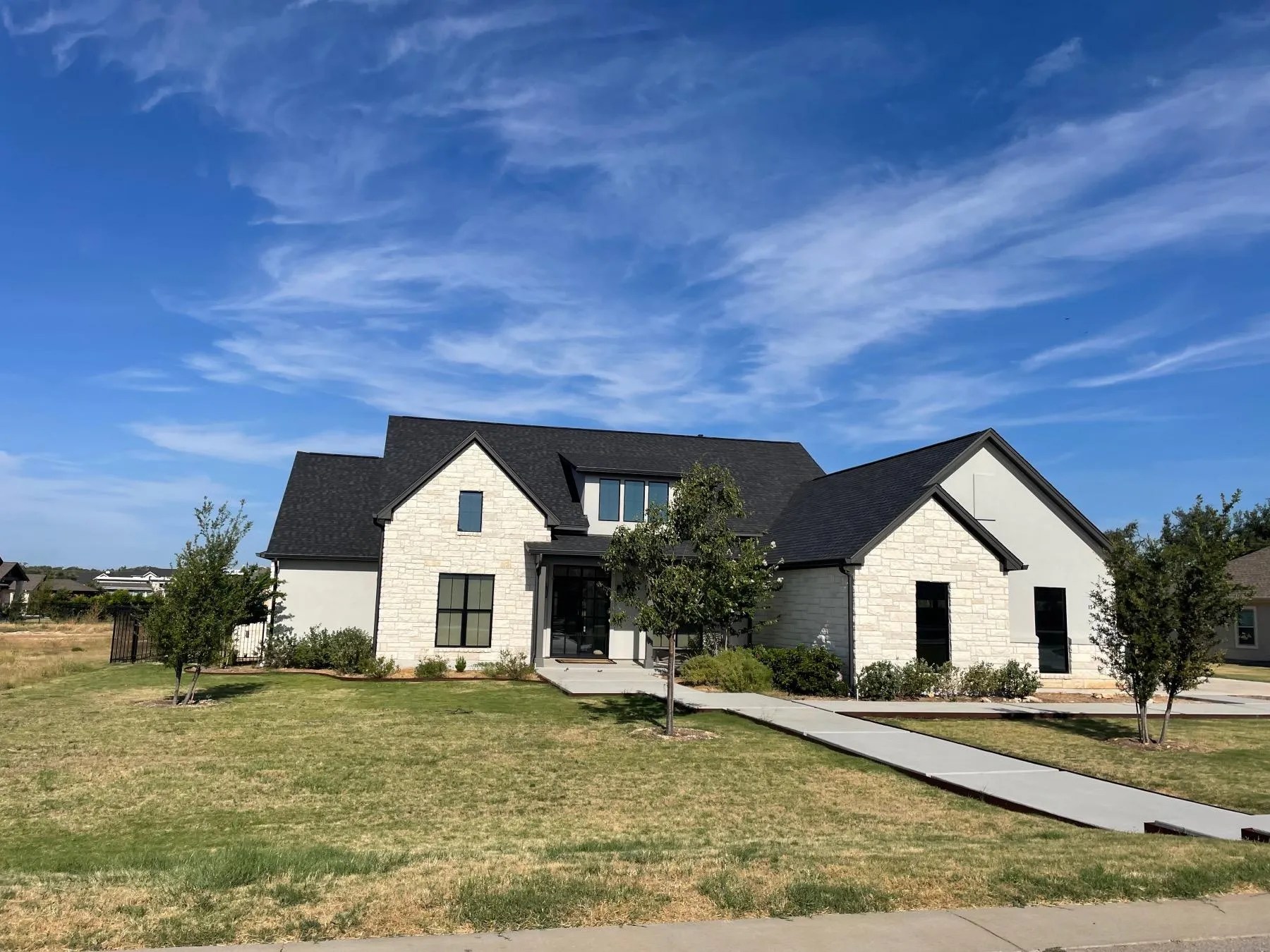 One-story stone masonry custom home in Bunker Ranch, Dripping Springs