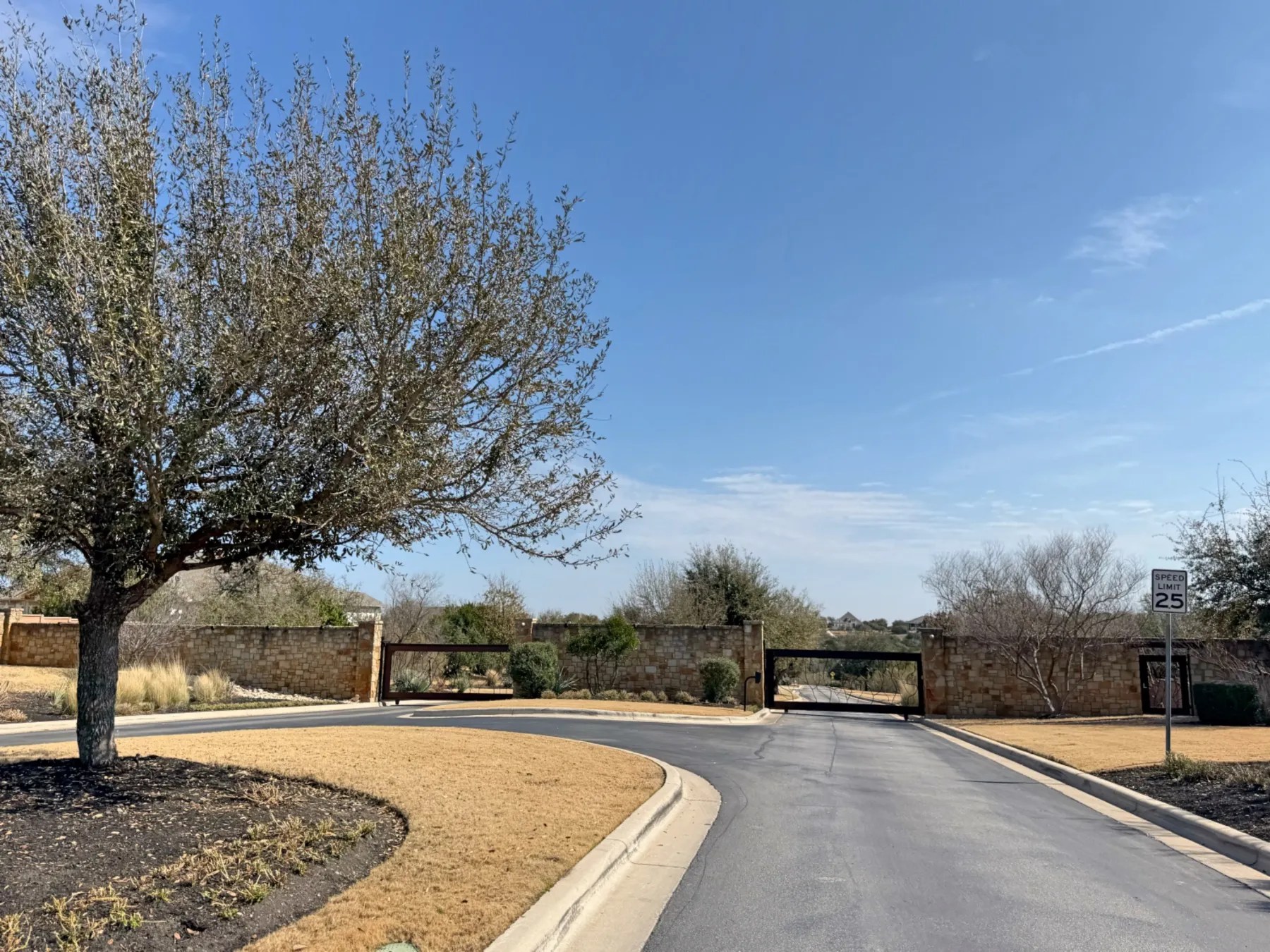 Gated luxury acreage community entrance at Saratoga Hills, Dripping Springs TX